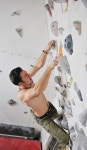 유토이미지 | young and fit man exercise free mountain climbing on indoor practice wall