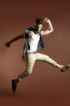 유토이미지 | 상세페이지 | 베이직샵 | 19663188 | High jumping fly young handsome fashion man on brown background