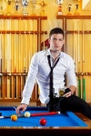 유토이미지 | Billiard handsome player man drinking some alcohol in club