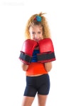 유토이미지 | boxer kid blond girl with funny boxing gloves on white background