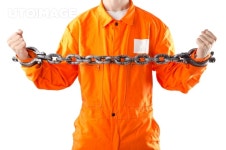 유토이미지 | Criminal in orange robe in prison