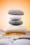 유토이미지 | Balanced pebbles with colour background