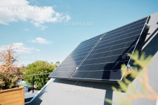 유토이미지 | Large solar panels on rooftop of modern comfortable house or cottage in natural environment