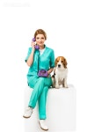 유토이미지 | smiling veterinarian with beagle dog near by talking on telephone isolated on white