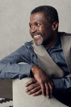 호연에프앤디 | portrait of handsome smiling middle aged african american man in waistcoat sitting in armchair | 유토이미지 | 상세페이지...