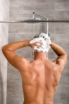 유토이미지 | back view of man washing hair with shampoo and taking shower
