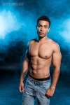 유토이미지 | sexy mixed race man standing in denim jeans and on blue with smoke 유토이미지 | sexy mixed race man standing in... 