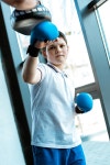 유토이미지 | boy in boxing gloves training with coach at gym