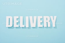유토이미지 | white delivery text with shadow on blue background with copy space