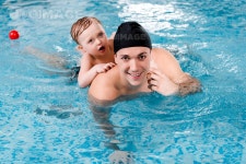 유토이미지 | happy swim coach and toddler boy training in swimming pool