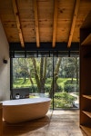Photo 11 of 14 in A Dramatic Hallway Forms the Spine of This Shou Sugi Ban Retreat in Mexico from L7 Home - Dwell Photo 11 of 14... 