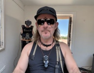 Man with tech gadgets in a bright room setting | Deep Dream Generator The Fedora Photographer and His Robot Companion | Deep... 