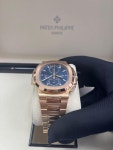 Patek Philippe Nautilus 5990/1R Travel Time Rose Gold Blue Dial for $300,000 for sale from a Trusted Seller on Chrono24