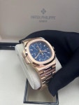 Patek Philippe Nautilus 5990/1R Travel Time Rose Gold Blue Dial for $300,000 for sale from a Trusted Seller on Chrono24
