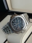 Patek Philippe Nautilus Travel Time Chronograph 5990/1A-001... for $167,000 for sale from a Trusted Seller on Chrono24