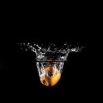 Free Photo | Orange plunging into the water