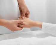 Osteopathist treating a patients arm | Free Photo