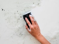 Free Photo | Top view of hand scrubbing dirt with sponge