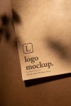 Premium PSD | Top view over press logo paper shadow mockup