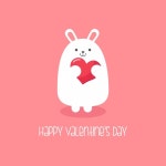 Premium Vector | White bunny rabbit holding heart