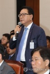 답변하는 정승인 코리아세븐 대표 | 연합뉴스