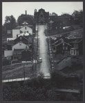 Street in Pittsburgh: Downhill; houses on either side; church at end of street | The Art Institute of Chicago