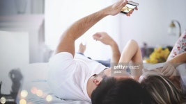Lazy Weekend Morning High-Res Stock Photo - Getty Images Closeup of a young couple relaxing in bed on a weekend morning. They...