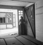 ‘‘Photograph of Eileen Agar in a warehouse or storage space‘, Anonymous, 1930s‘, Anonymous, 1930s – Tate Archive | Tate