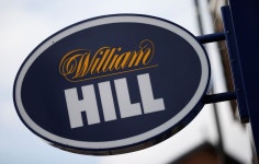 Online gambling firm 888 soars on deal to pay less for William Hill assets