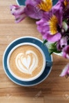 Beautiful Blue Mug With Cappuccino Or Latte Coffee On A Wooden Table. View From Above. Breakfast In The Cafe. 로열티 무료 사진... 