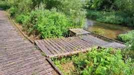 Hopes to replace uneven river walkway