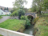 Disused railway bridge spanning an... © Eric Jones cc-by-sa/2.0 :: Geograph Britain and Ireland Disused railway bridge spanning... 