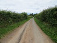 Hedge-lined minor road heading towards... © Peter Wood :: Geograph Britain and Ireland Hedge-lined minor road heading towards...... 