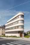 limestone & glass wrap around residential building in luxembourg limestone and glass wrap around the curved facade of residential... 