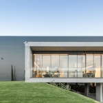 ana coelho adds concrete volume to host office spaces in portugal ana coelho adds elevated concrete volume to host office spaces... 