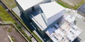 translucent plastic layers and timber frames expand house M in japan