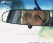 a0139-000054 | 게티이미지코리아 | Woman Applies Mascara in Car Royalty-Free 이미지