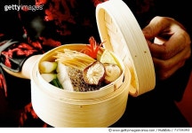 71734393 | 게티이미지코리아 | Woman holding steaming basket with sea bass, ginger, vegetables Royalty-Free 이미지
