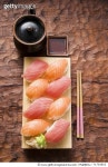 71734553 | 게티이미지코리아 | Nigiri sushi with tuna and salmon on sushi board Royalty-Free 이미지