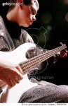 830006-001 | 게티이미지코리아 | Teenage boy (16-18) playing electric guitar, close-up Royalty-Free 이미지