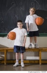 82830969 | 게티이미지코리아 | Two boys holding basketballs in gym Royalty-Free 이미지