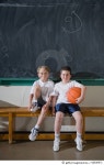 82830971 | 게티이미지코리아 | Two boys sitting on gym bench, portrait Royalty-Free 이미지