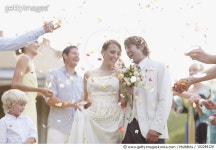 102284126 | 게티이미지코리아 | Guests throwing rose petals on bride and groom Royalty-Free 이미지