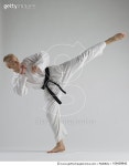 109439942 | 게티이미지코리아 | Young man performing karate kick on white background Royalty-Free 이미지