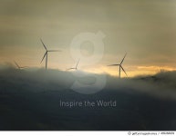 499268839 | 게티이미지코리아 | Wind turbines on a misty hill in Romania Royalty-Free 이미지