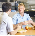 503675941 | 게티이미지코리아 | High school boys eating healthy lunches together in cafeteria Royalty-Free 이미지