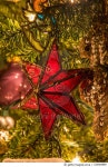 520484889 | 게티이미지코리아 | Ornate Glass Purple Star Hanging in Christmas Tree Royalty-Free 이미지
