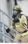 473790430 | 게티이미지코리아 | Fireman in protective suit, oxygen mask climbing stairs Royalty-Free 이미지