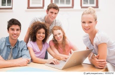 493953767 | 게티이미지코리아 | Confident university students with laptop at desk Royalty-Free 이미지