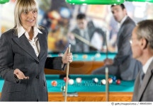 486401604 | 게티이미지코리아 | Business people communicating and playing billiard. Royalty-Free 이미지
